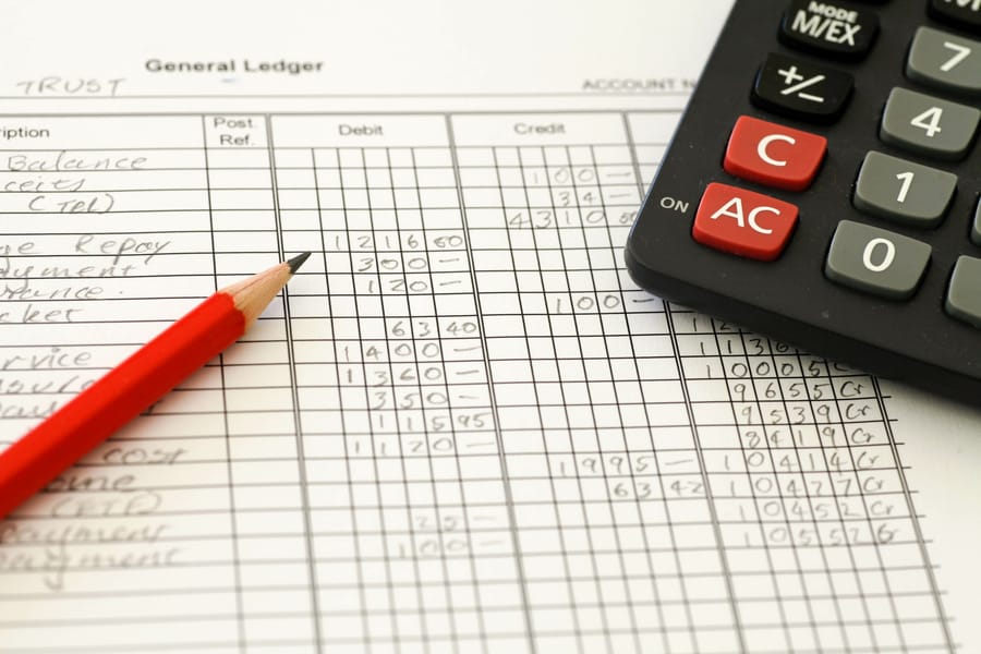 Chart of accounts Australia: handwritten general ledger with debit and credit columns, red pencil and calculator